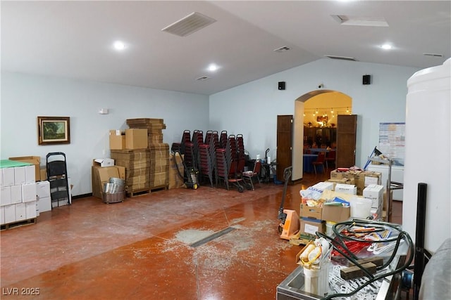 misc room featuring vaulted ceiling and concrete floors