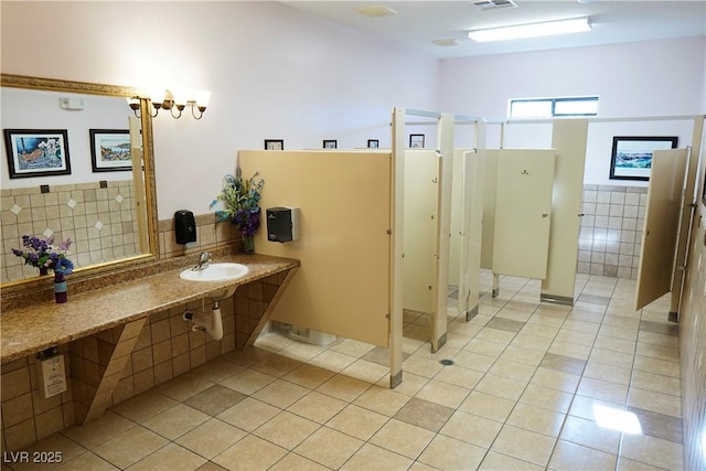 bathroom featuring tile patterned flooring and sink