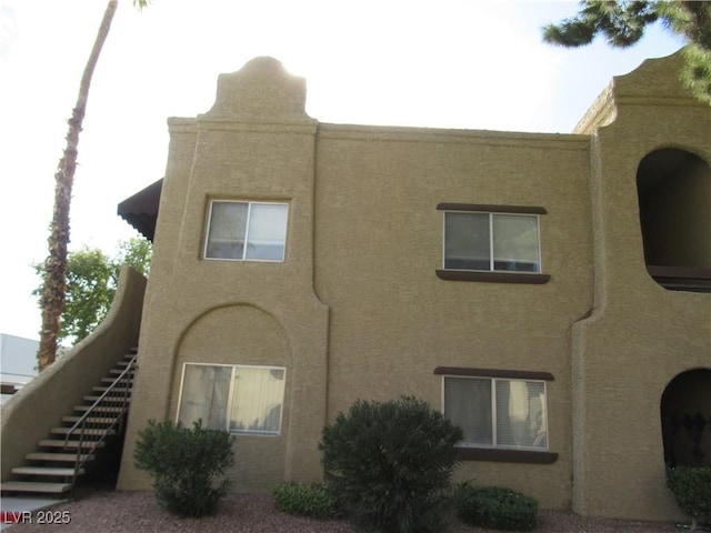 view of building exterior with stairway