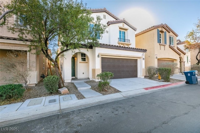 mediterranean / spanish-style house featuring a garage