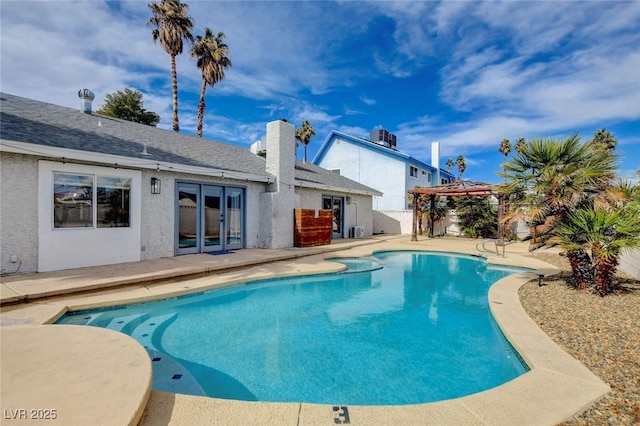 view of swimming pool featuring a gazebo, central AC, a patio area, and french doors