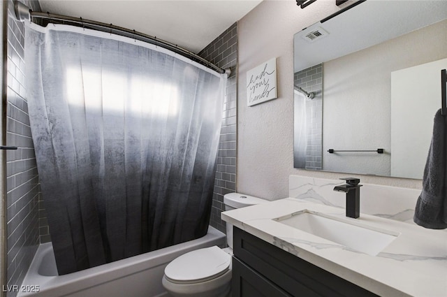 full bathroom featuring vanity, shower / tub combo, and toilet