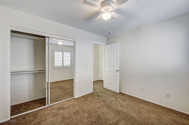 unfurnished bedroom featuring ceiling fan, dark carpet, and a closet