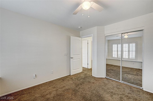 unfurnished bedroom with carpet flooring, ceiling fan, and a closet