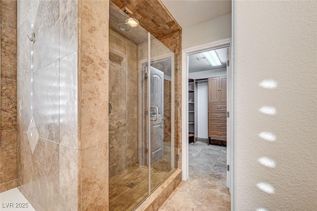 bathroom featuring a shower with door