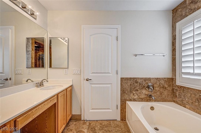 bathroom featuring a bathing tub and vanity