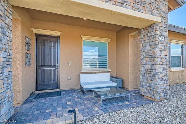 entrance to property with a patio area