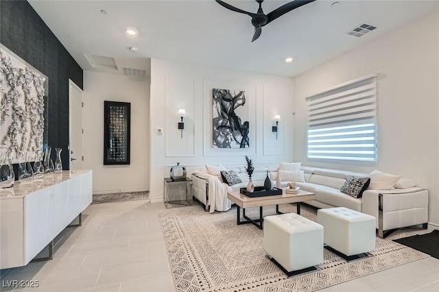 tiled living room with ceiling fan