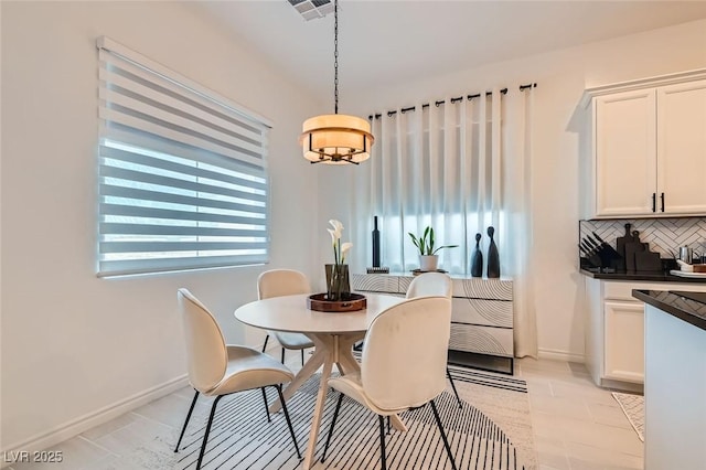 dining area featuring light tile patterned floors