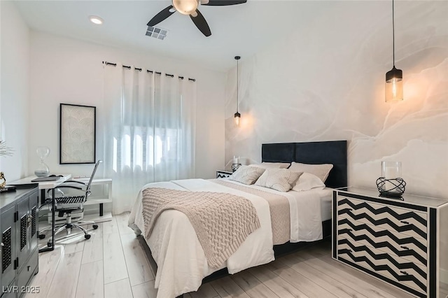 bedroom featuring ceiling fan and light hardwood / wood-style floors