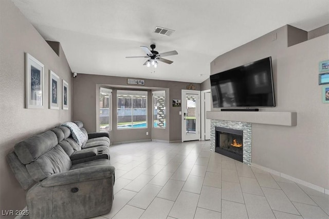 living room featuring lofted ceiling and ceiling fan