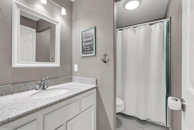 bathroom featuring vanity, tile patterned floors, toilet, and a shower with shower curtain