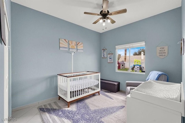 tiled bedroom with ceiling fan