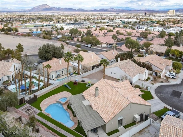 birds eye view of property featuring a mountain view