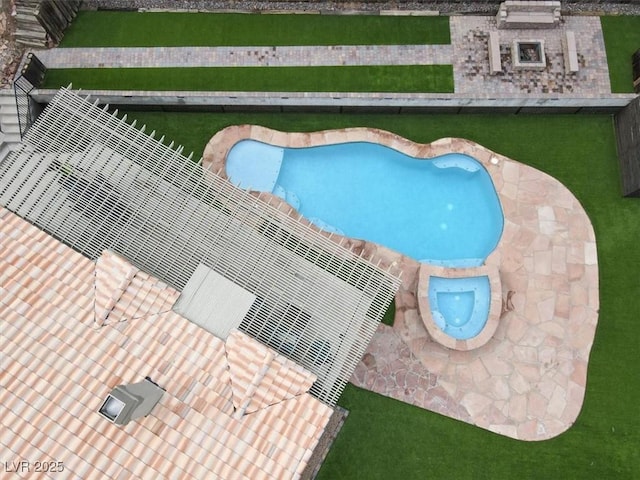 view of pool with a patio area and an in ground hot tub