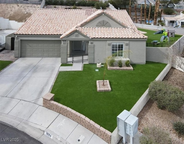 single story home featuring a garage and a front yard