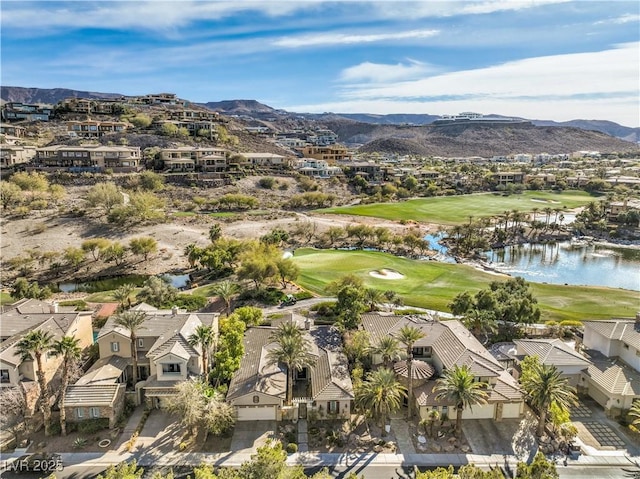 drone / aerial view featuring a water and mountain view