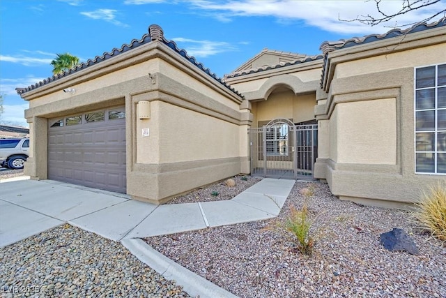 view of exterior entry with a garage