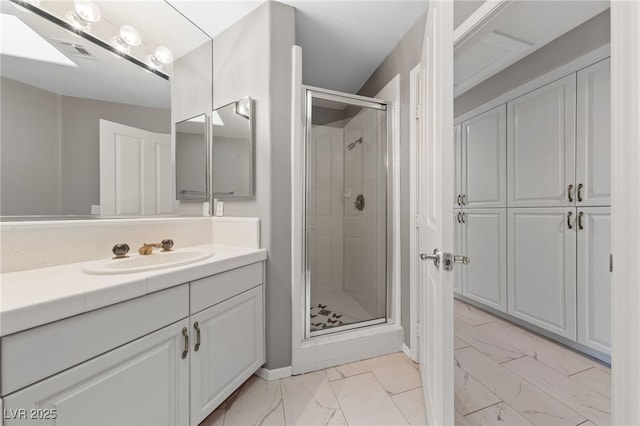 bathroom with an enclosed shower and vanity