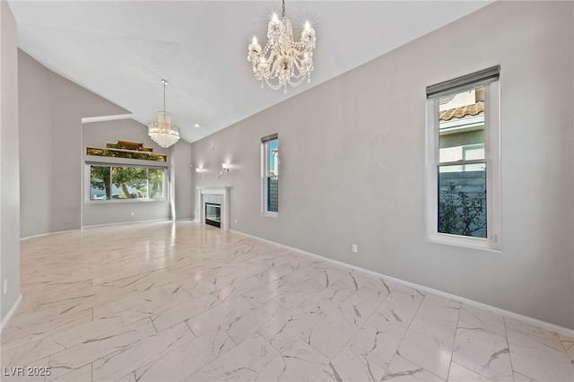 unfurnished living room with lofted ceiling and a chandelier