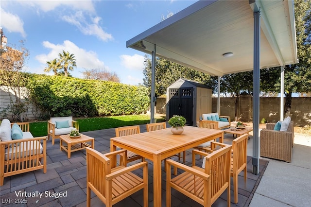 view of patio featuring an outdoor hangout area and a storage shed