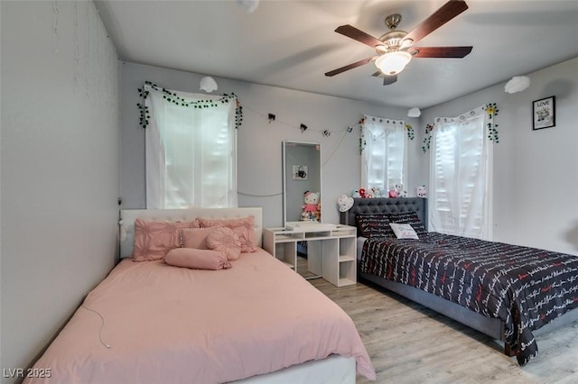 bedroom with ceiling fan and wood finished floors