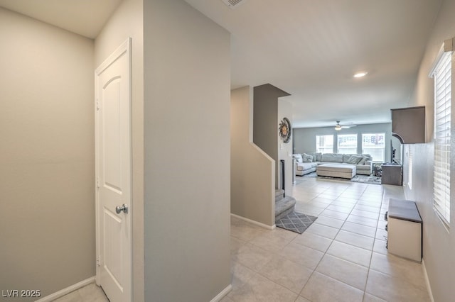 hallway with light tile patterned floors