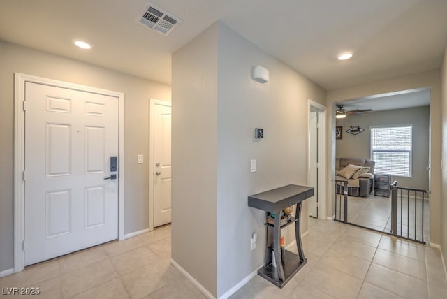 hall with light tile patterned flooring