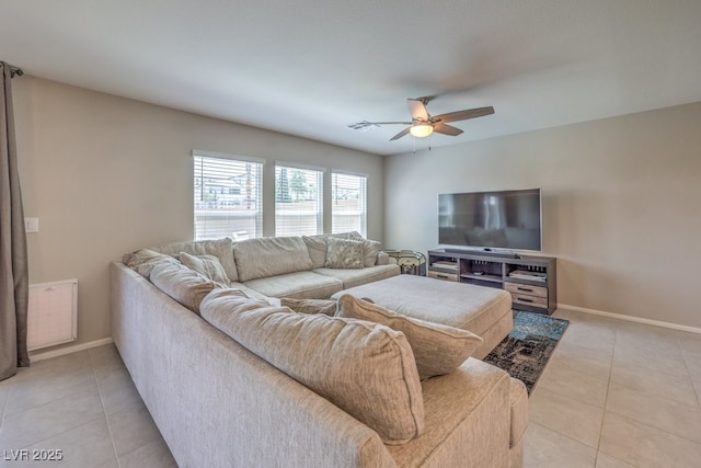 tiled living room featuring ceiling fan