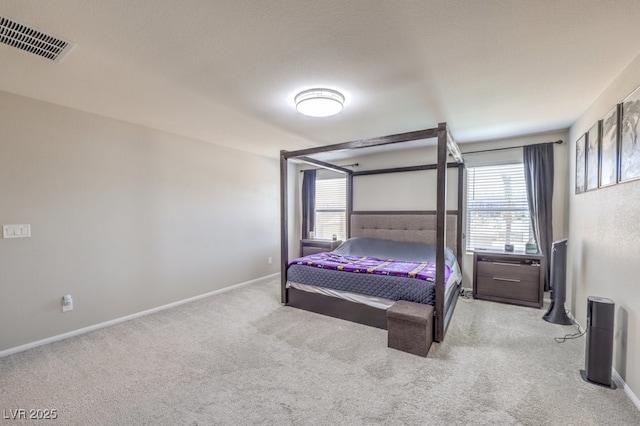 bedroom featuring light colored carpet