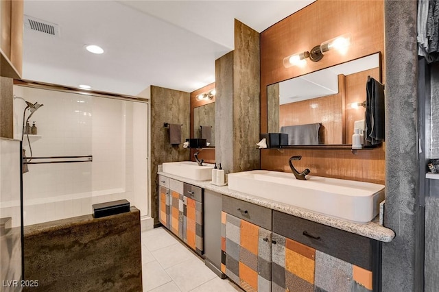 bathroom with tile patterned flooring, vanity, and a shower with shower door