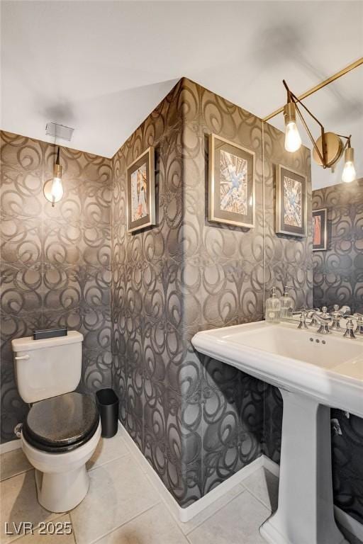 bathroom with sink, tile patterned floors, and toilet