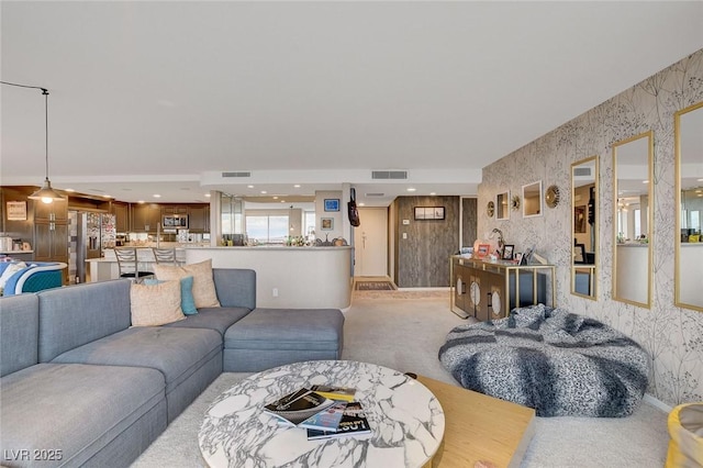 living room with light colored carpet