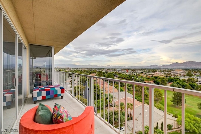 balcony featuring a mountain view