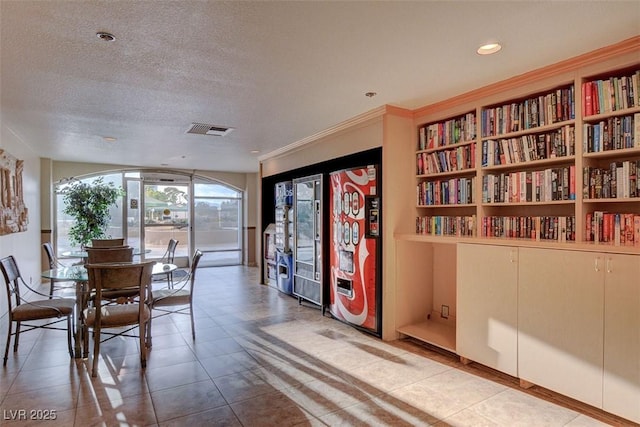 dining room with a textured ceiling