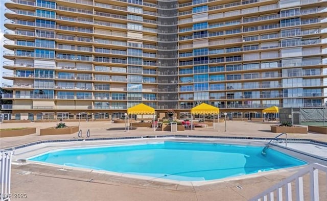 view of swimming pool with a patio