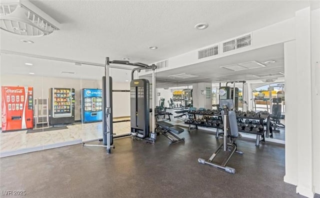 exercise room featuring a textured ceiling