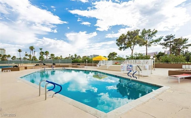 view of pool featuring a patio