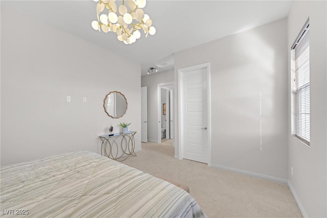 bedroom featuring a notable chandelier and light colored carpet