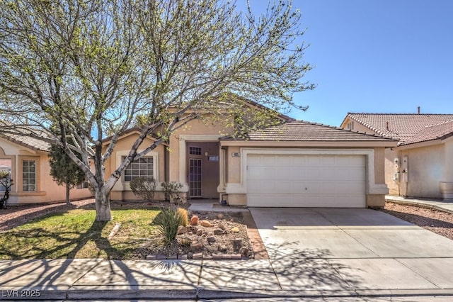 ranch-style house with a garage, concrete driveway, a tiled roof, and stucco siding