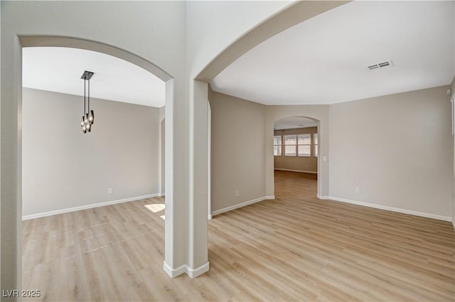 unfurnished room featuring light wood-type flooring