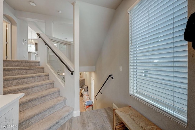 stairway with wood finished floors