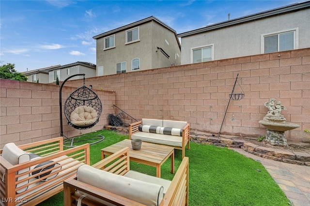 view of yard with outdoor lounge area and a fenced backyard