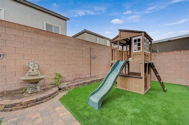 view of jungle gym featuring a fenced backyard