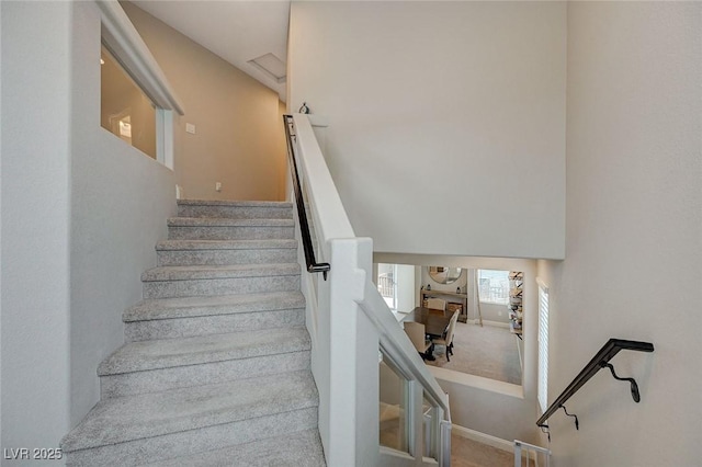 stairs with carpet and baseboards