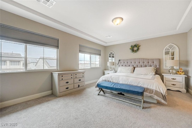 bedroom featuring visible vents, baseboards, and carpet floors