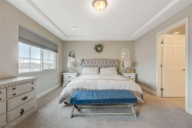 bedroom featuring light colored carpet, visible vents, and baseboards