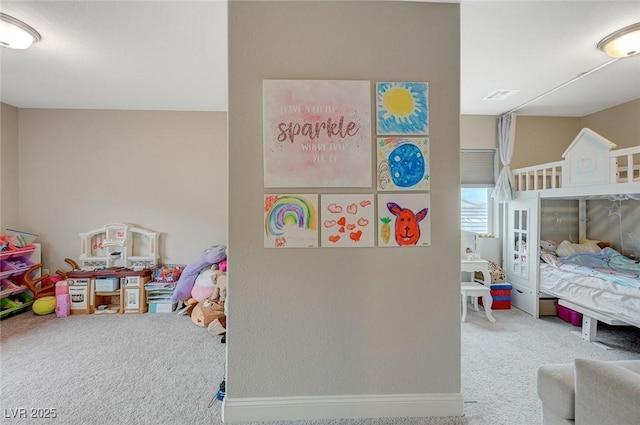 carpeted bedroom with visible vents and baseboards