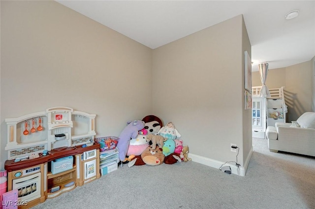 game room with carpet flooring and baseboards