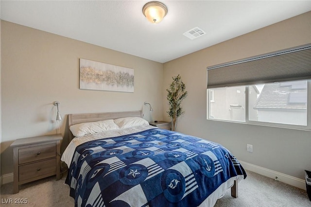 bedroom with visible vents, baseboards, and carpet